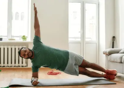 Beginners bodyweight workout plan on a notepad with exercises like squats and planks